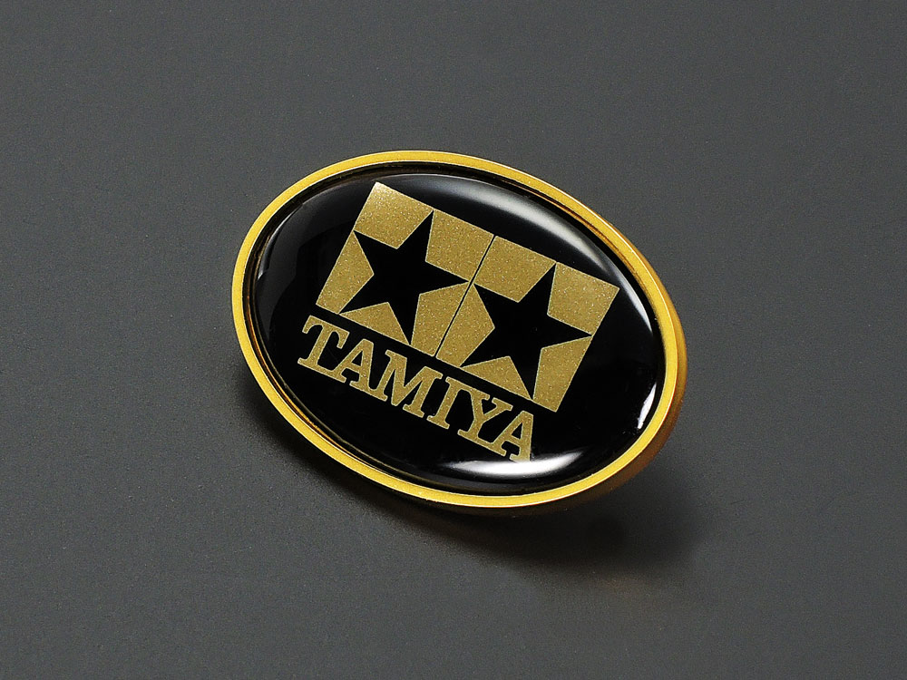 タミヤオリジナルグッズ タミヤピンバッジ ロゴマーク丸型（黒／金） | タミヤ
